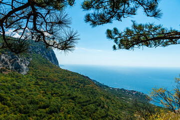 Fototapeta na wymiar Beautiful view of the Black Sea from the mountain. The Crimean Peninsula. Seascape in sunny weather