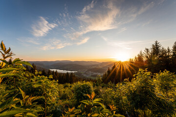 Beautiful colored sunset at lake Titisee shot from hochfirst a mountain in the black forest