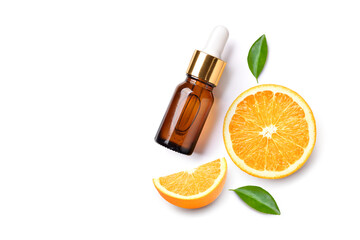 Flat lay (top view) Orange essential oil serum with orange fruit sliced  isolated on white...