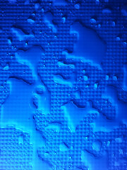 Splashes of water on shower tray highlighted in color