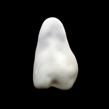 Natural crude cacholong stone on black background 