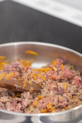 Cooking minced meat with tomato sauce