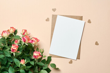 Greeting card mockup with roses bouquet and small hearts on paper background