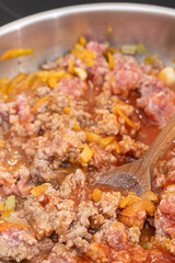 Cooking minced meat with tomato sauce