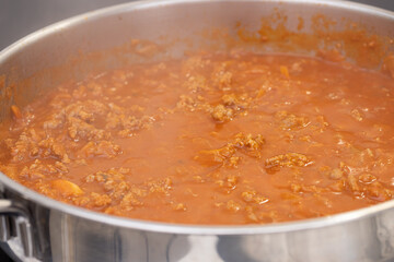 Cooking minced meat with tomato sauce