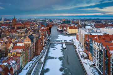 Obraz premium Beautiful old town of Gdansk with port crane at sunset, Poland