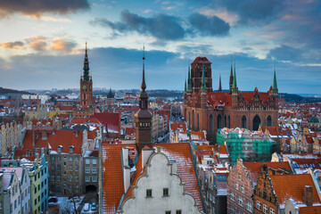 Fototapeta premium Beautiful old town of Gdansk with Saint Mary Basilica at sunset, Poland