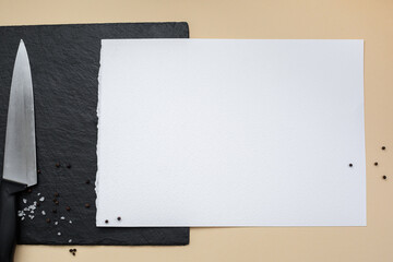 Abstract minimalistic background with elements of the food. Plate, blackboard and white sheet for writing recipes