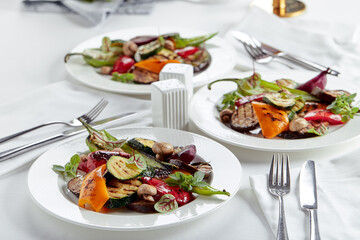 Grilled vegetables on a white plates. restaurant