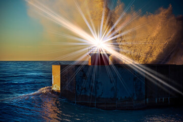 Italian lighthouse at sunset with waves and splashes of water at the port entrance (Italy-Tuscany-Pisa City-Marina Location)