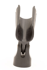 Black plastic microphone holder isolated above white background