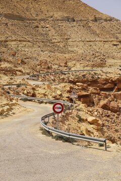 Road Sign In Desert Mountain