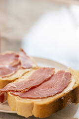 Sandwich with sliced dried ham on the bread