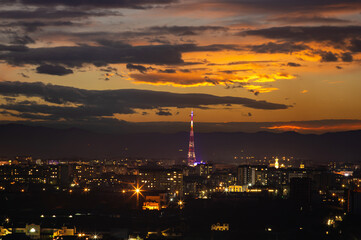 Fototapeta premium TV tower in the Ukrainian city at sunset