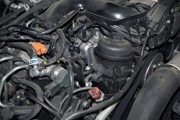 The many different tubes, sensors and different parts show the intricacies of a modern engine. 