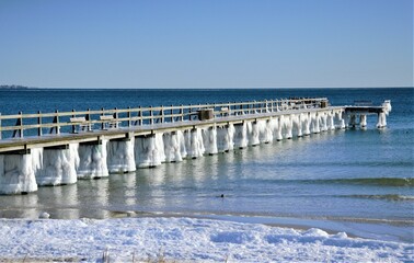 pier on the beach at winter