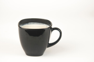 a glass of milkshake or smoothie on a white background