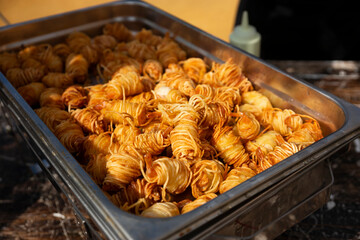tray of prawns battered with fried noodles served at a wedding