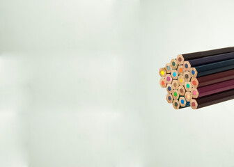 multicolored sticks on a gray background. colored pencils on light texture