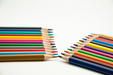 colored pencils on a white background. education concept. illustration of training.