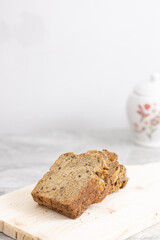 Healthy dark flour toast bread on the wooden board.