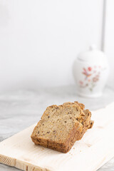 Healthy dark flour toast bread on the wooden board.