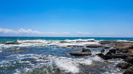 Turkey, one of the most beautiful sights and spectacular nature of antalya summer day sparkling blue sea sparkling waves and rocks.