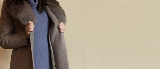 the woman shows a beautiful fur coat