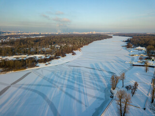 The frozen Dnieper river in Kiev. Aerial drone view. Winter sunny frosty morning.