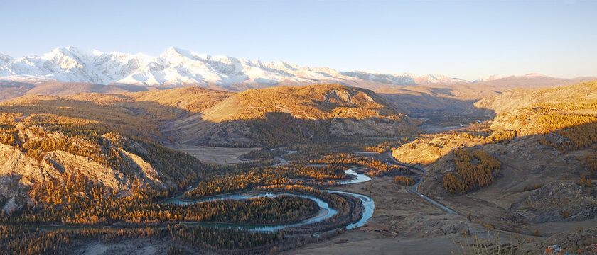 Kurai steppe, the valley of the river Chuya and North Chuya range in autumn at sunset