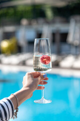 glass of champagne in hand
