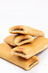 Cookies with fruit filling above white background