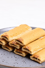 Cookies with fruit filling above white background