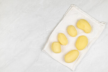 Cleaned and sliced raw potatoes ready for cooking