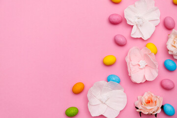 Easter bunny. Happy Easter holiday background concept.Flat lay colorful bunny egg with accessory to celebration on modern rustic pink pastel paper at home office desk.