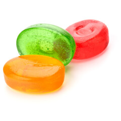 Three colorful fruit hard sugar candies,  boiled sweeties or sugar plums isolated on white background cutout