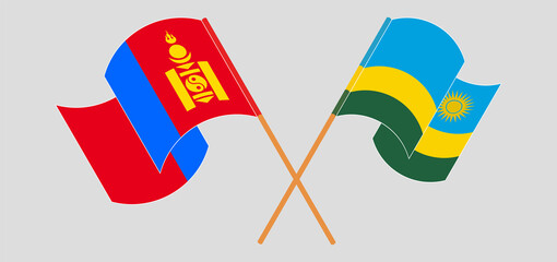 Crossed and waving flags of Mongolia and Rwanda