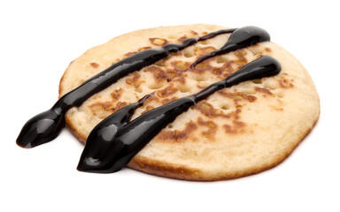 One pancake with chocolate syrup isolated on white background cutout.