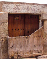 Antique wooden door with batepuerta typical in the village of Candelario, Salamanca, Spain