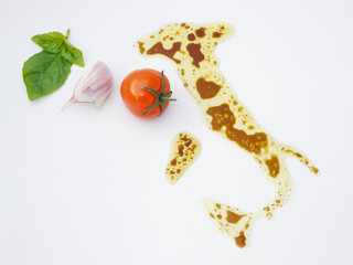 Italian flag, culture and cuisine concept: typical colors and ingredients of famous Italian dishes, pasta sauce, Italian map as symbol.