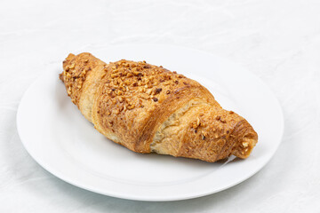 Croissant with chocolate on the plate