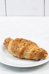 Croissant with chocolate on the plate