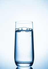 water glass on blue background