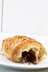 Croissant with chocolate on the plate