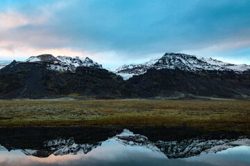 Iceland, reflection of the mountains in the Vatnajökull glacier. Panoramic view of the Vatnajökull National Park. Europe