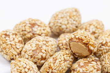 Fried peanuts with sesame above white background