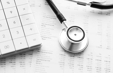 Stethoscope and calculator. Concept of health care costs or medical insurance