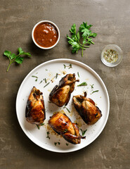 Roasted quails on plate