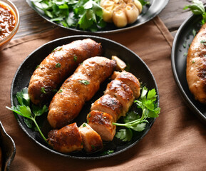 Roasted sausages in frying pan