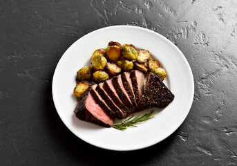 Grilled beef steak with brussels sprouts